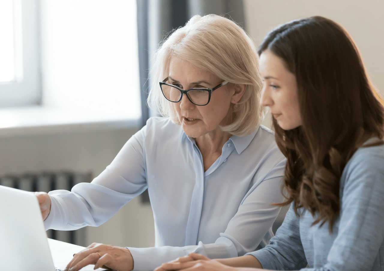 Senior woman getting advice on laptop