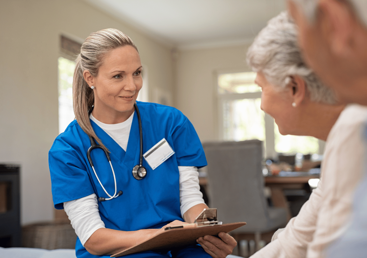 Nurse talking to an elderly couple