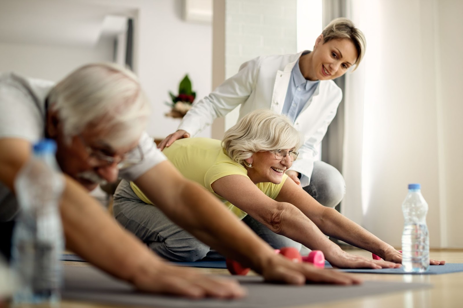 Group of elderly individuals participating in a physiotherapy for arthritis exercise class